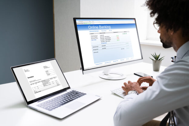 An image of a woman using invoice factoring for her business provided by an invoice factoring company.
