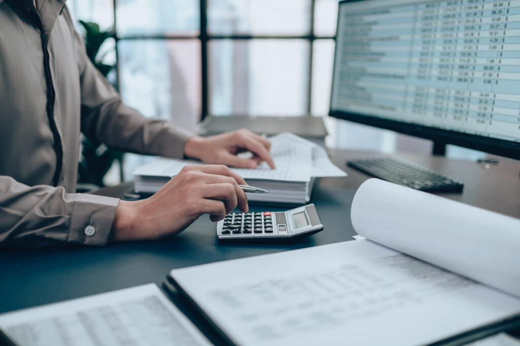 an image of an accounting person at a staffing agency crunching numbers.